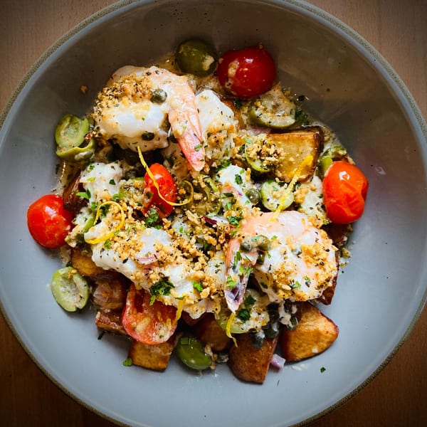 Pomelia's shrimp dish with roasted potatoes, cherry tomatoes, green olives, and lemon zest.
