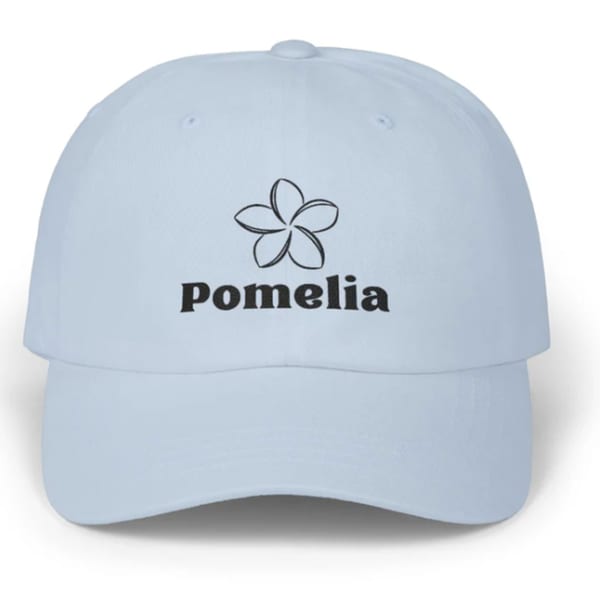 Light blue baseball cap with the Pomelia restaurant logo and name embroidered in black.